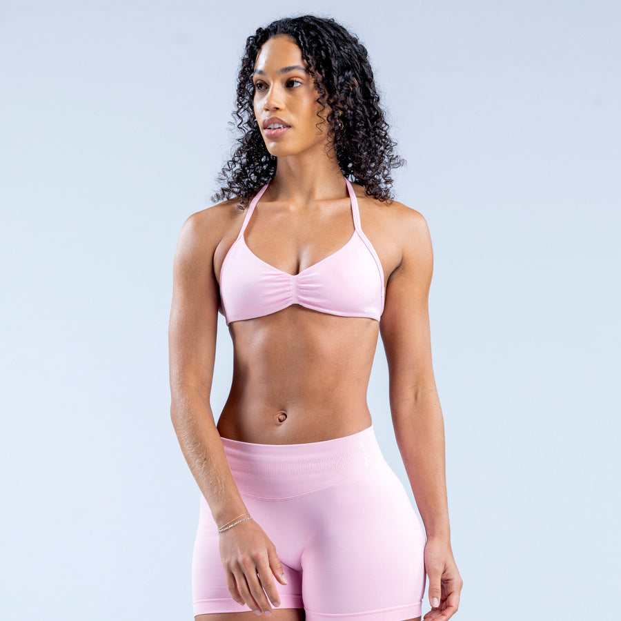 Light pink strappy bra with ruched center and thin shoulder straps