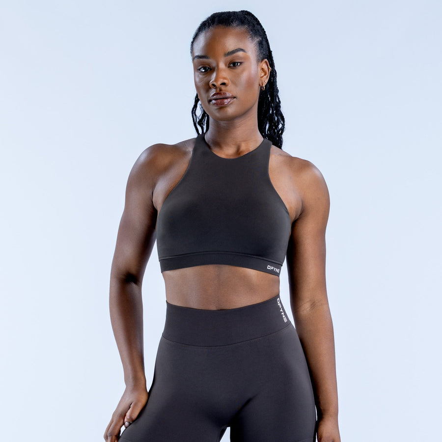 Black racerback sports bra with racer neckline and cropped front coverage