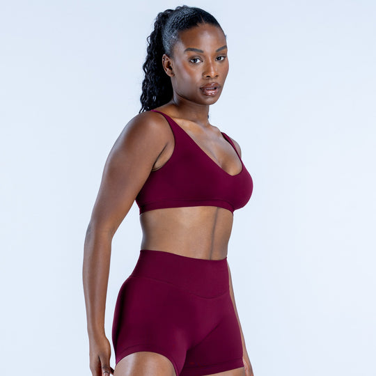 Burgundy scoop-neck sports bra, front view