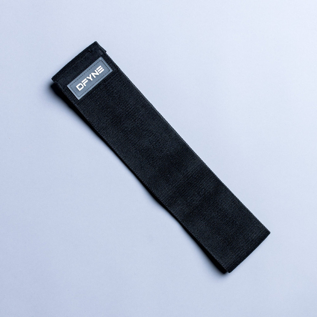 Black resistance band with small rectangular logo label