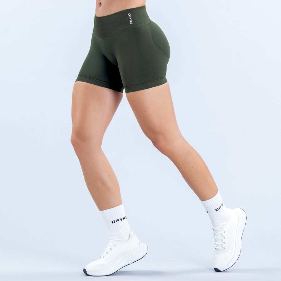 Dark green 4.5-inch fitted shorts with a high-rise waistband, shown from the front.