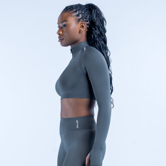 Dark gray side view of cropped long-sleeve athletic top with quarter-zip