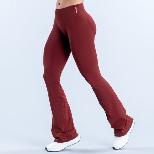 Burgundy flared leggings with a high waistband, shown from the front at an angle
