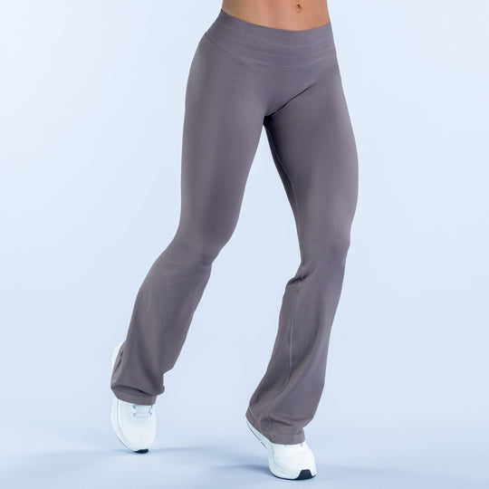 Dark gray bootcut flare leggings with high-rise waistband and tapered fit