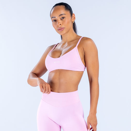 Pink scoop-neck bra with thin straps and smooth contoured cups