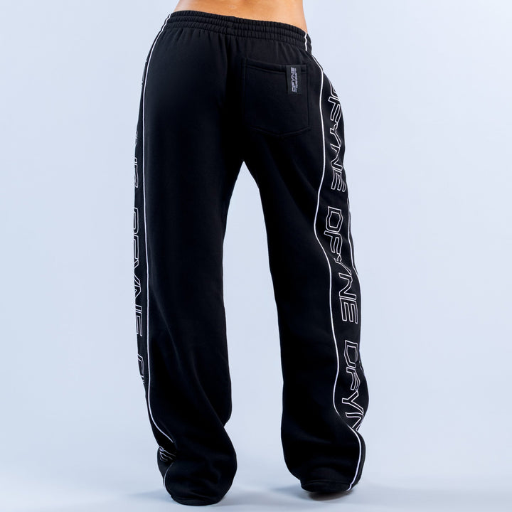 Black wide-leg joggers with elastic waist, back pocket, and white side text print