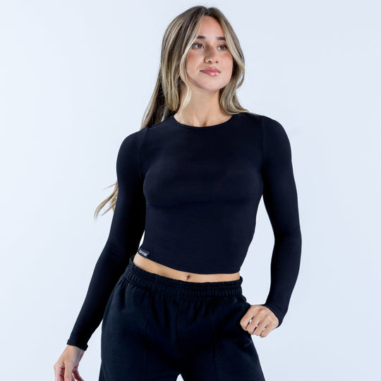 Dark ribbed long sleeve crop top with crew neck and fitted waist hem