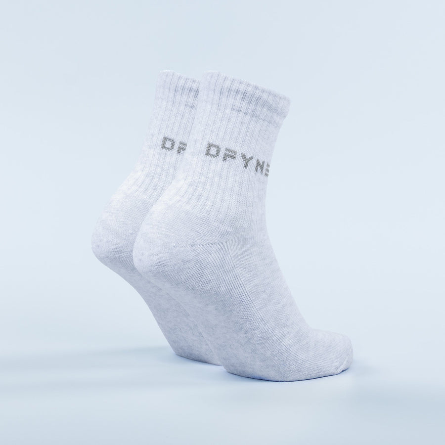 Light blue ribbed quarter socks showing side logo and cushioned sole, pair