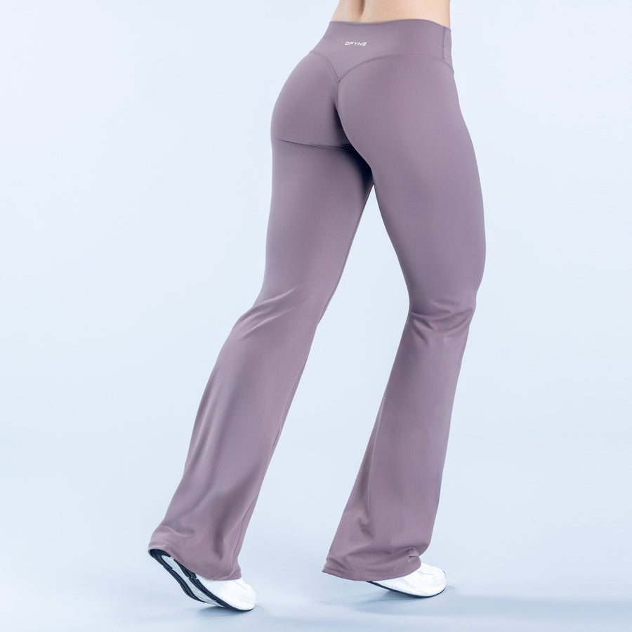 Women's flared leggings, mauve/purple, back view with wide bell hem