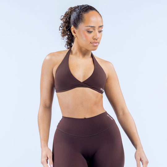 Dark brown halter bra with deep V neckline and smooth cropped fit