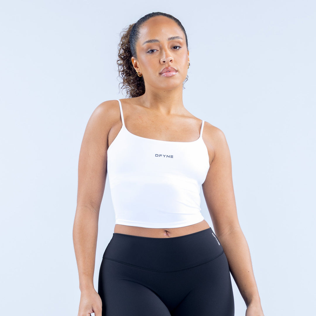 White strappy sports crop top with thin straps and square neckline, small chest logo