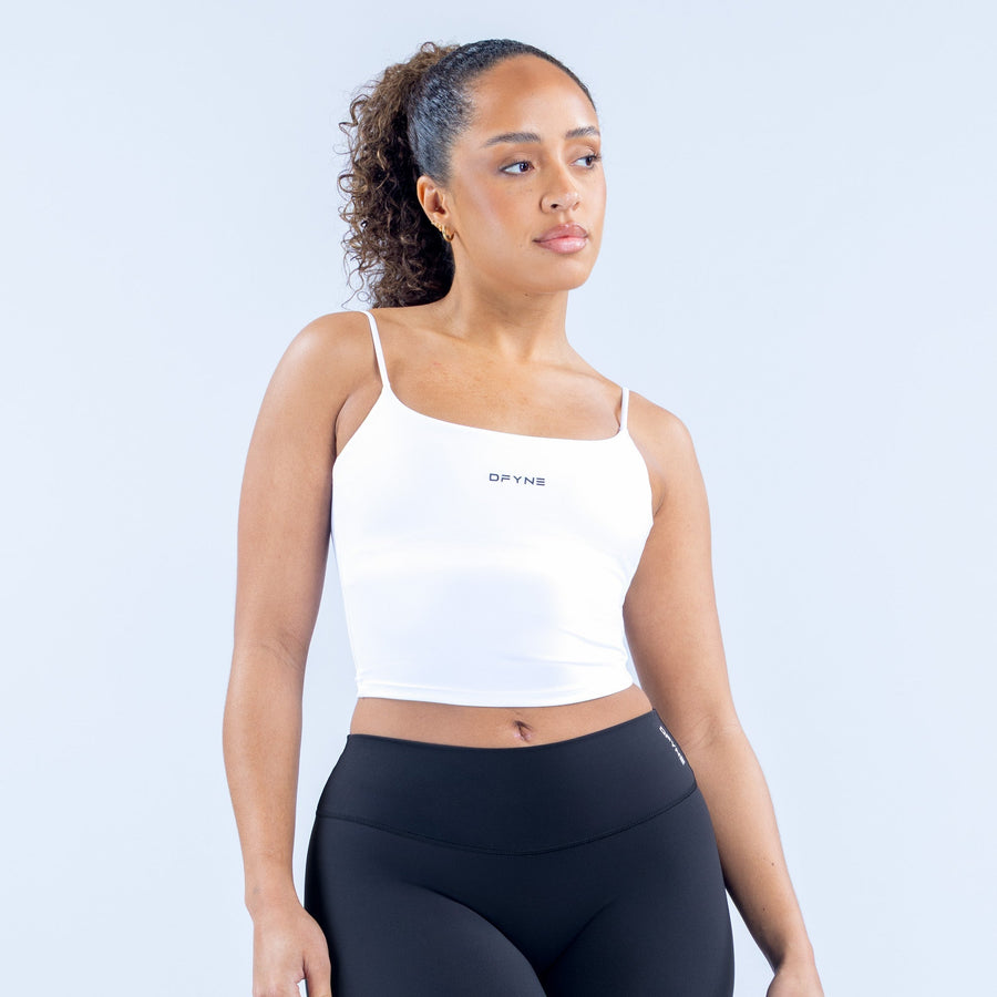 White strappy crop top with thin straps, square neckline, centered chest logo