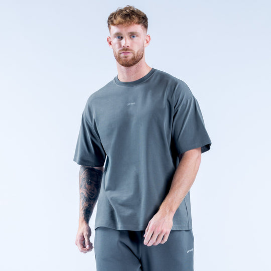 Men's dark teal crew-neck T-shirt with small chest logo, short sleeves