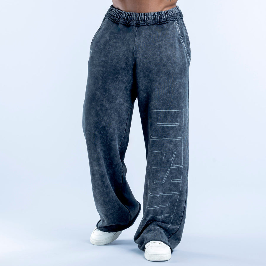 Washed jogger pants in dark navy with elastic waistband and graphic side print