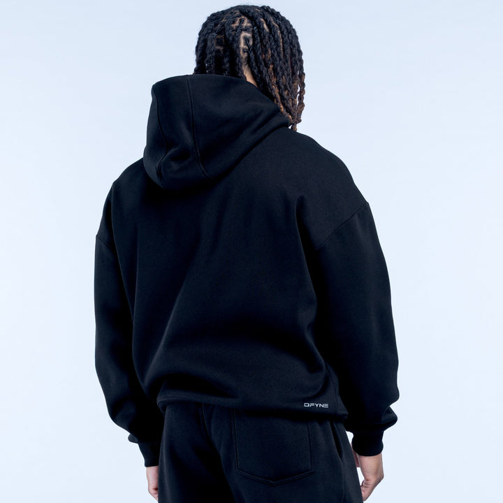 Black hoodie back view with hood and small hem logo, long sleeves