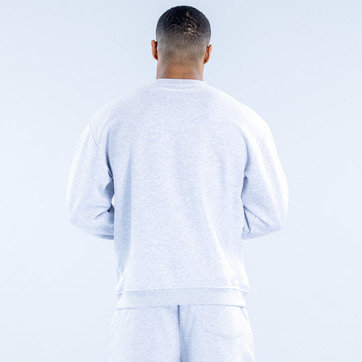 Back view of light heather gray crewneck sweatshirt, long sleeves with ribbed hem