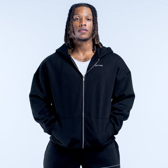 Black zip-up hoodie with hood and front zipper, relaxed fit, small chest logo