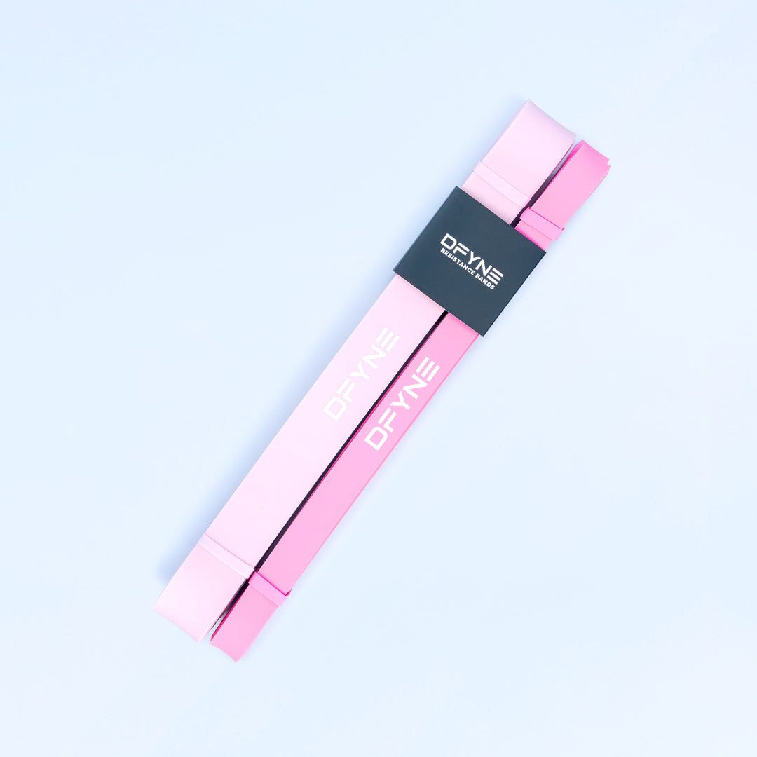 Pink resistance bands with OFYNE branding, bundled in a pair
