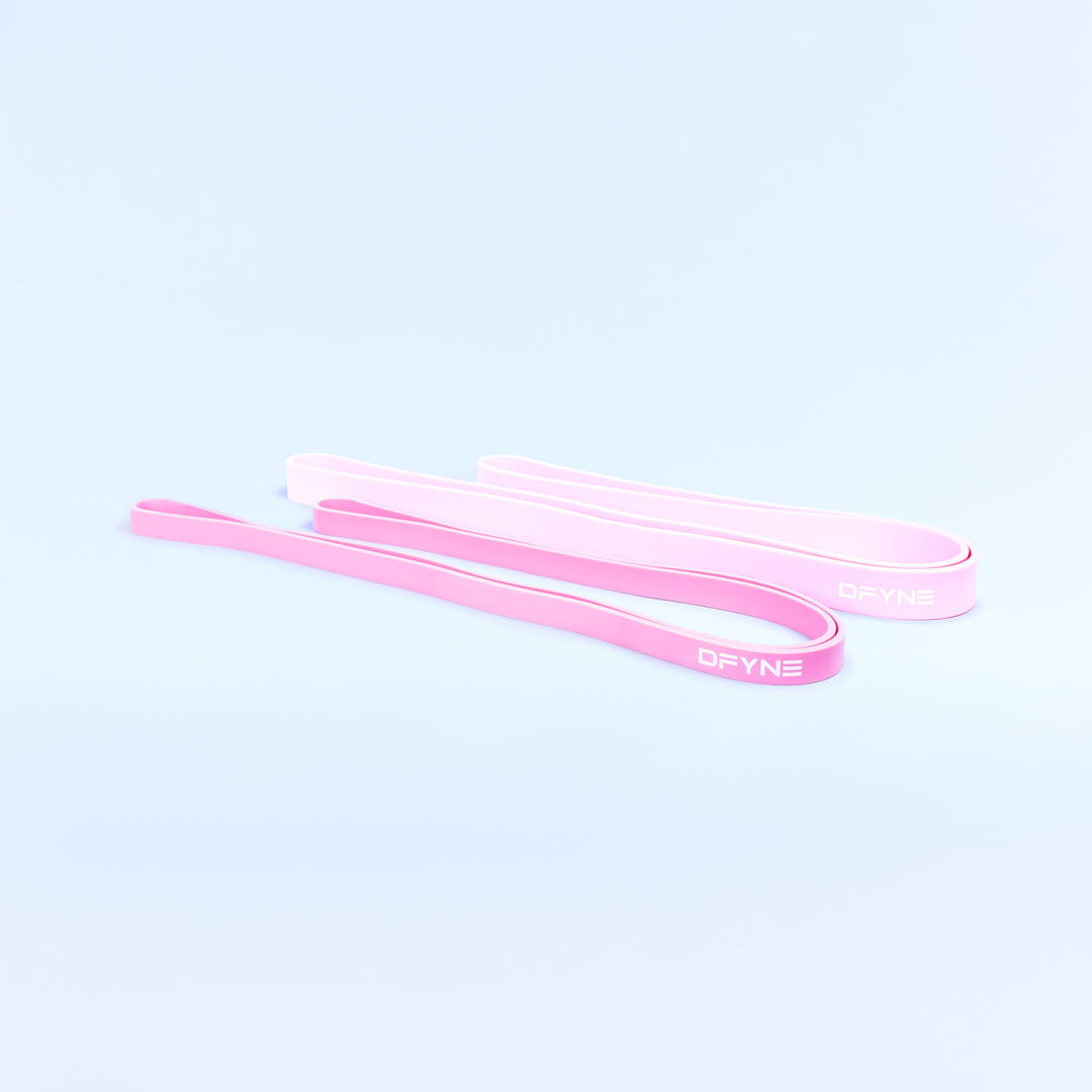 Pink resistance bands, flat loop straps shown