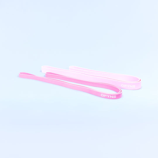 Pink resistance bands, flat loop straps shown