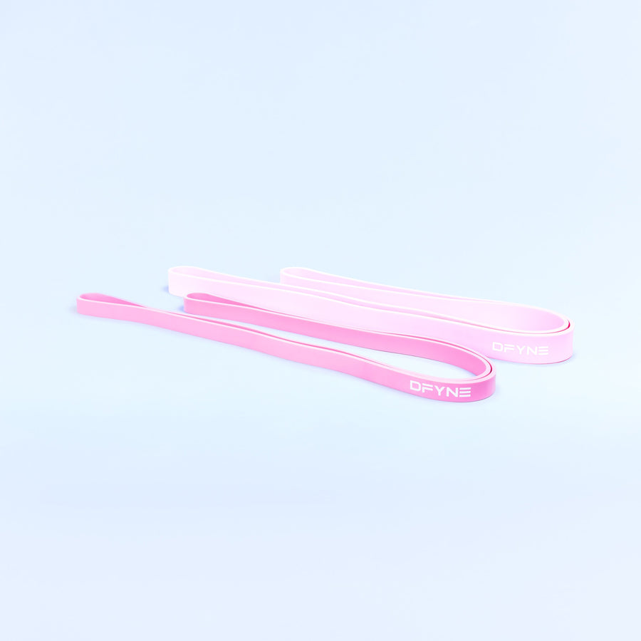 Pink resistance bands, flat loop straps shown