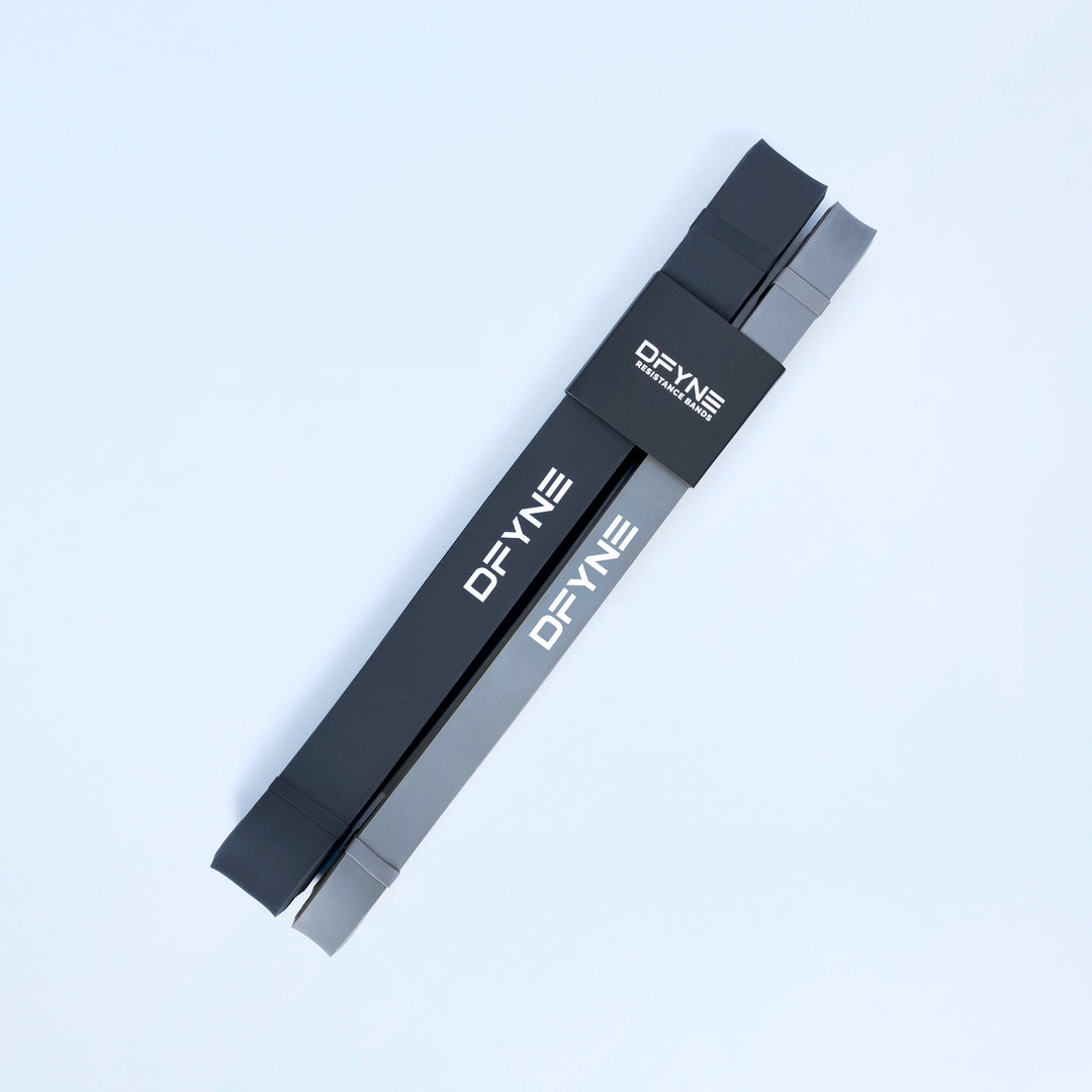 Resistance bands 2-pack: two flat black loop bands with printed DEYNE branding