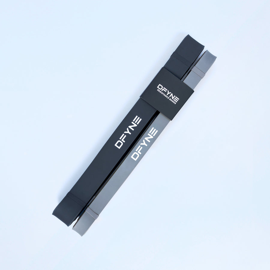 Resistance bands 2-pack: two flat black loop bands with printed DEYNE branding