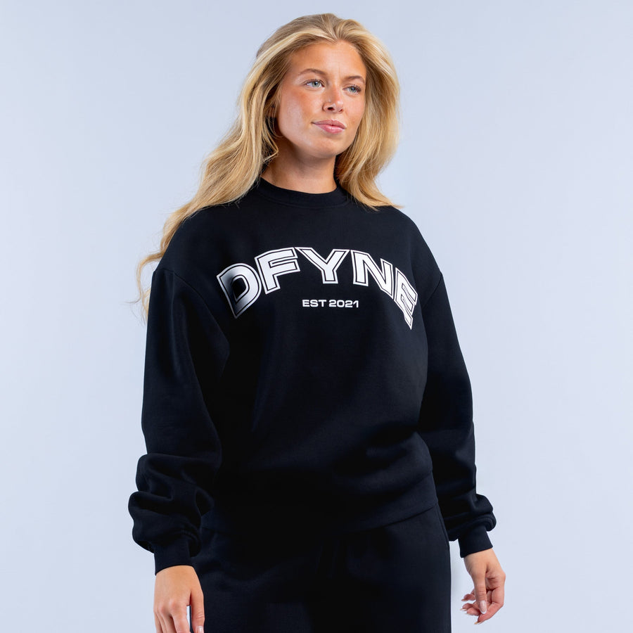 Black graphic sweatshirt with large OFYNE logo and EST 2021 print
