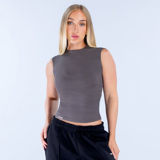 Dark gray ribbed sleeveless top with high neck and fitted cropped hem
