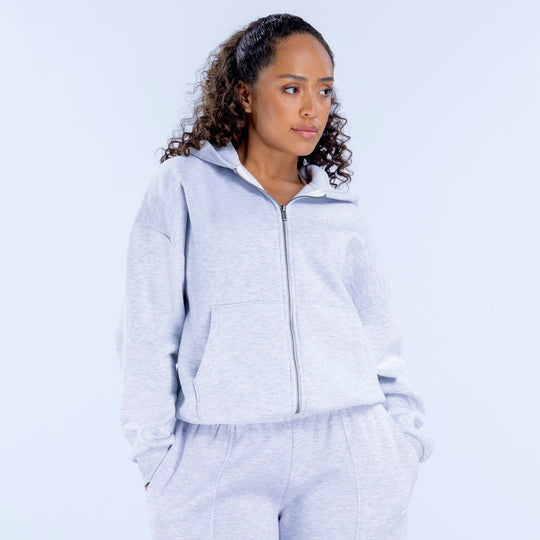 Light blue zip-front hoodie with stand collar, front zipper, and kangaroo pocket
