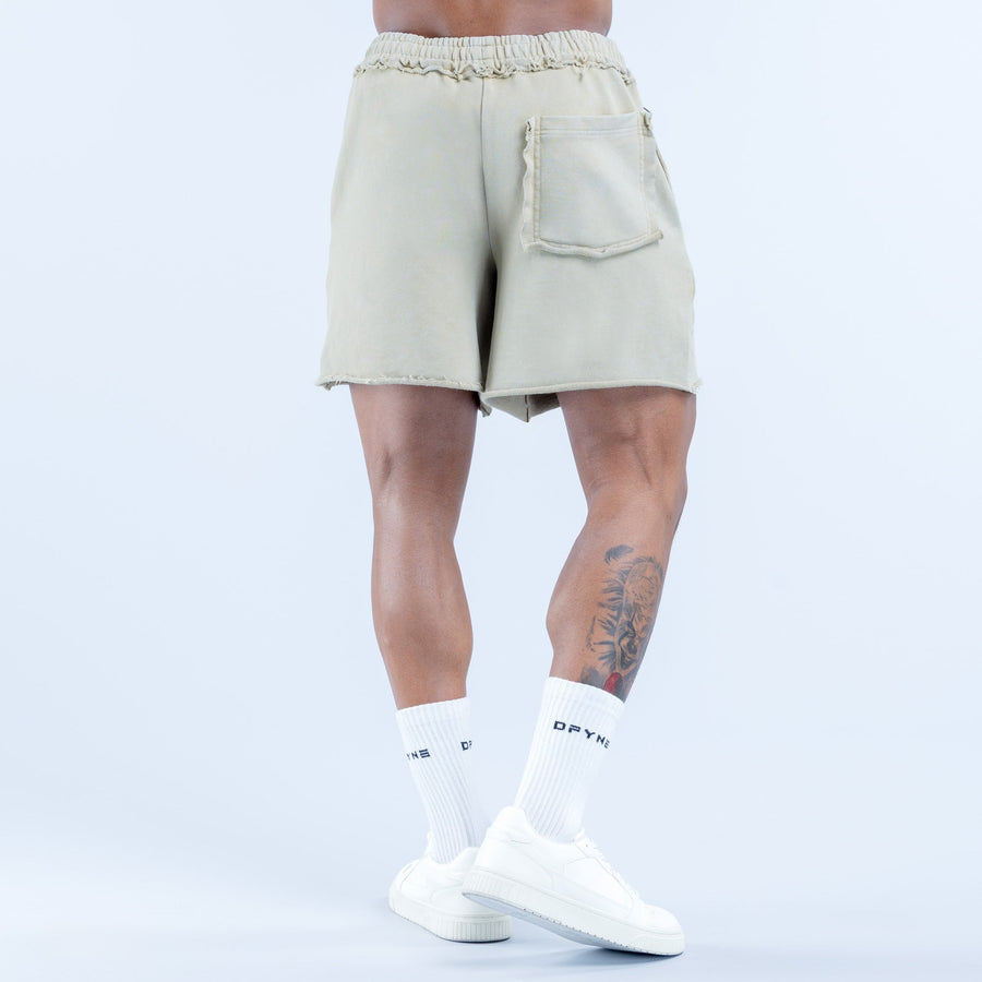 Light sage washed shorts, back view with elastic waistband and patch pocket
