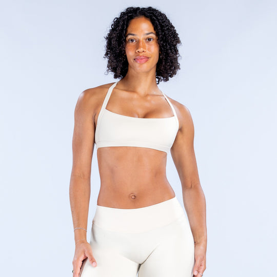 White halter sports bra with wide square neckline