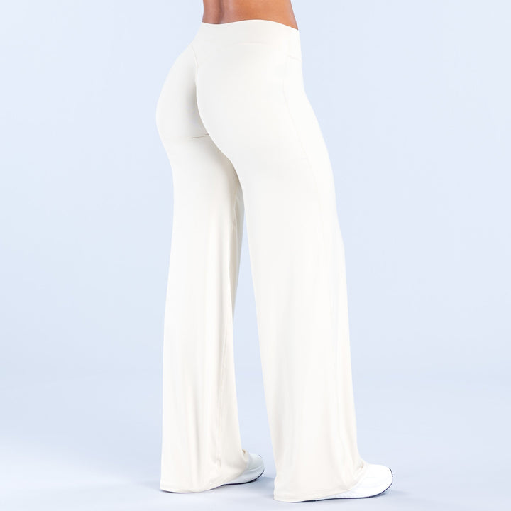Women's off-white wide-leg pants front three-quarter view with smooth, wide pant legs