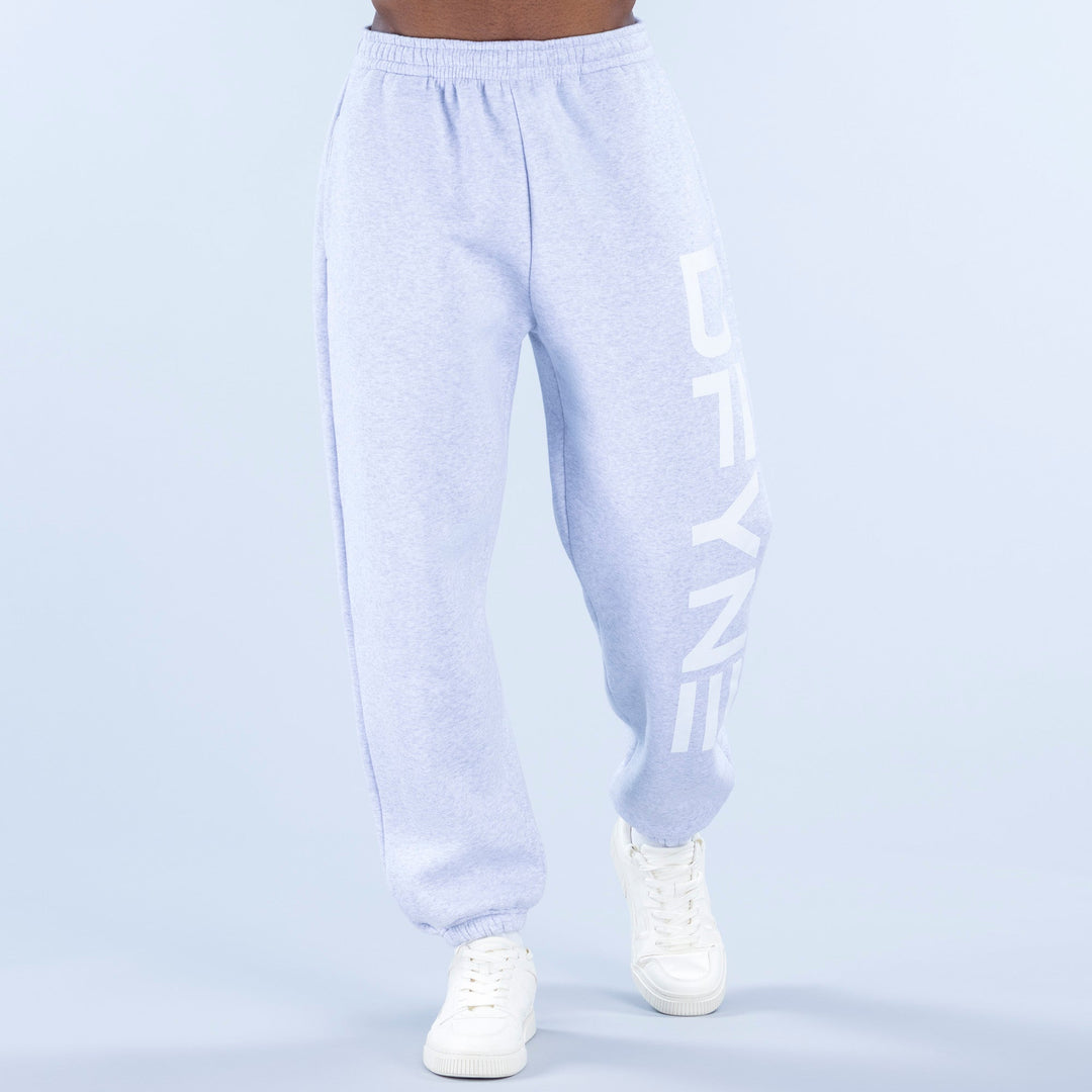 Light blue cuffed jogger pants with elastic waistband and side logo print
