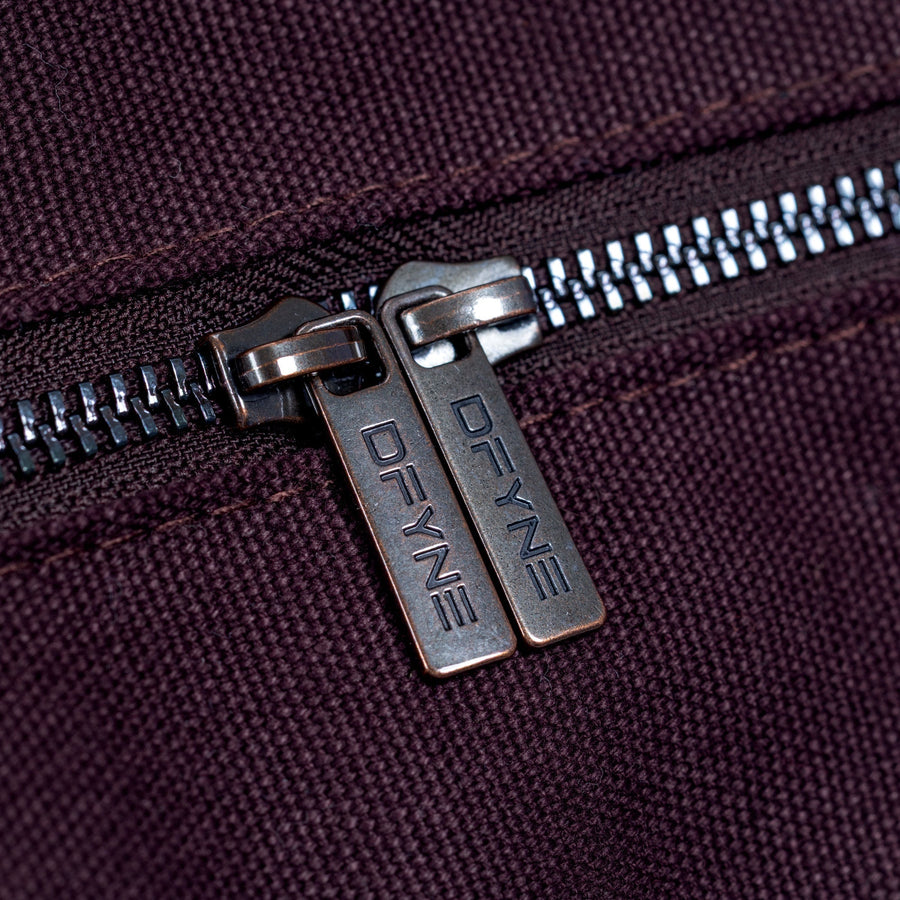 Burgundy duffle bag zipper with branded metal pull tab
