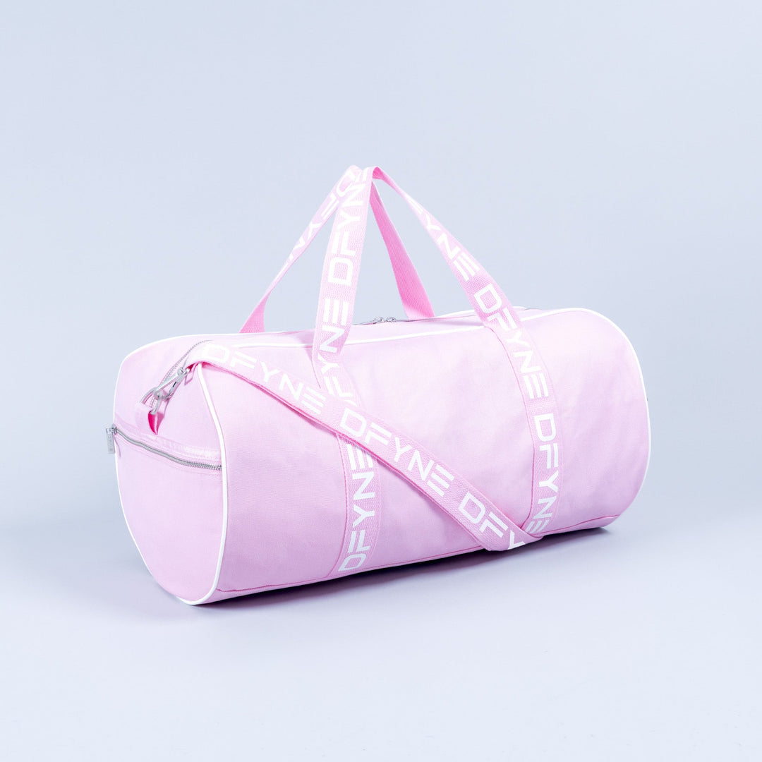 Light pink duffle bag with zip top, side zipper pocket, and logo strap handles.