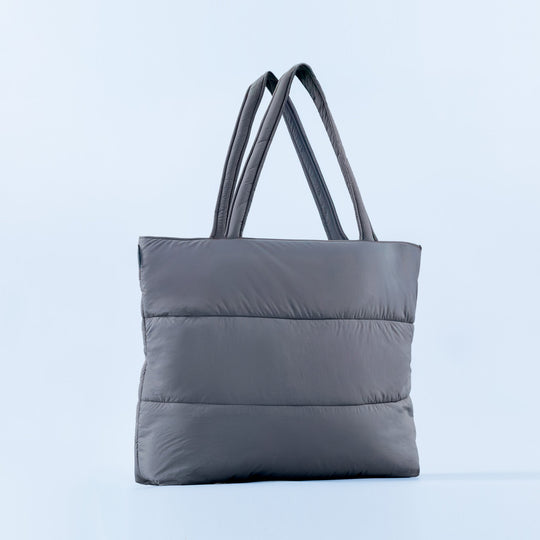 Gray puffer tote bag with two top handles and quilted horizontal baffles