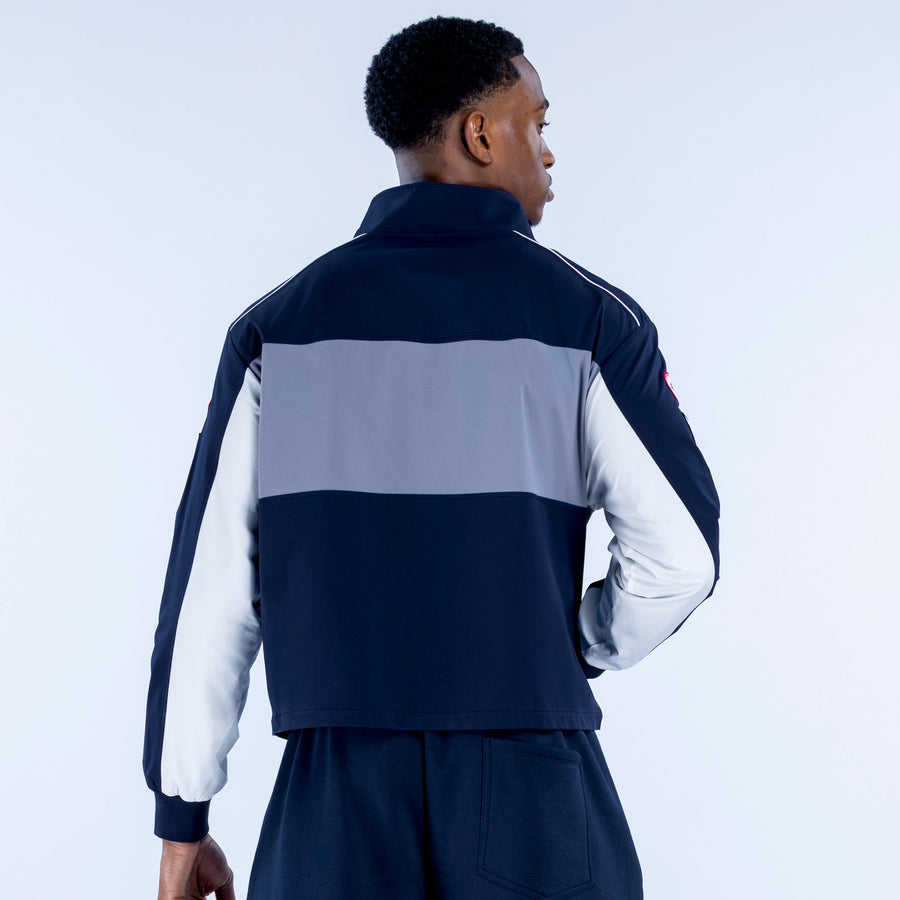 Men's navy and white colorblock track jacket, full-zip, back view