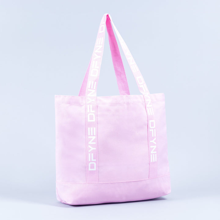 Light pink tote bag with logo handle tape and front panel seam detail.