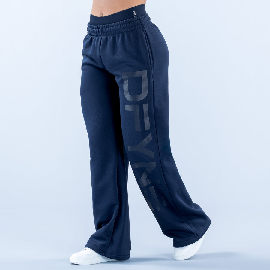 Dark navy wide-leg jogger pants with elastic waistband and drawstring, side pockets