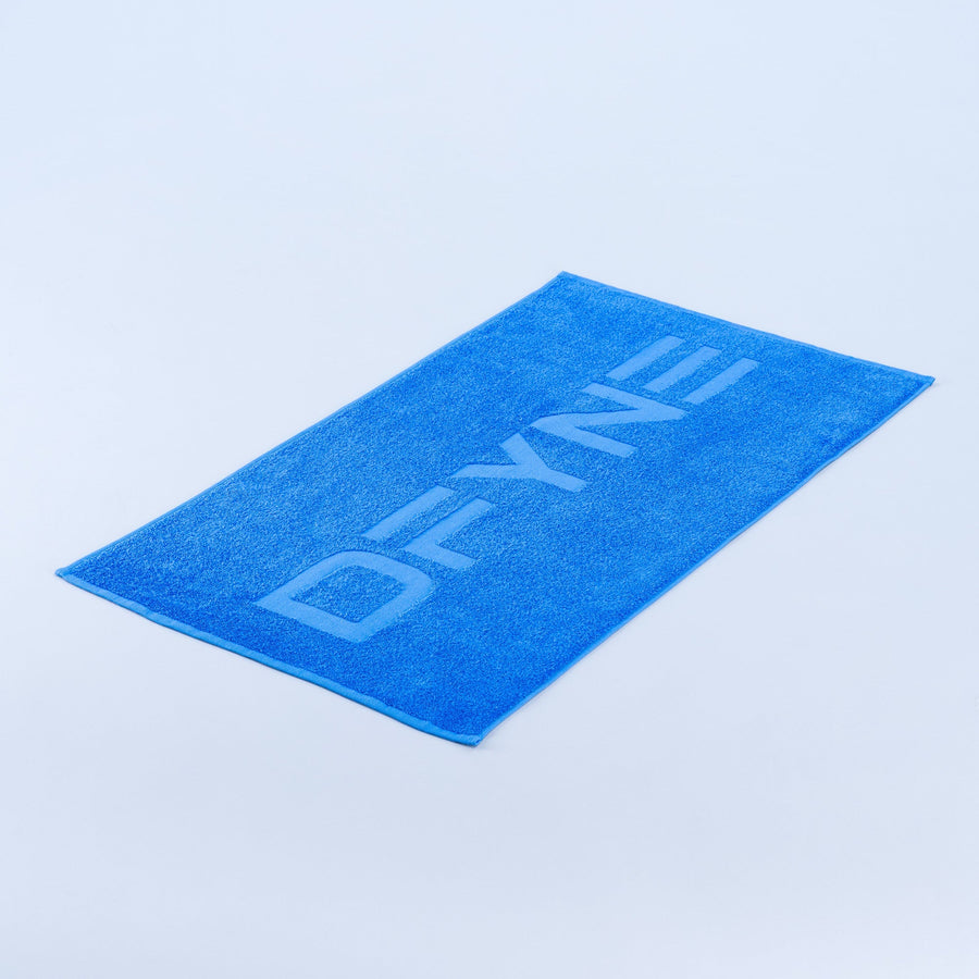 Blue gym towel, folded with large woven text logo