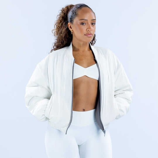 Reversible bomber jacket in white with front zipper and ribbed cuffs
