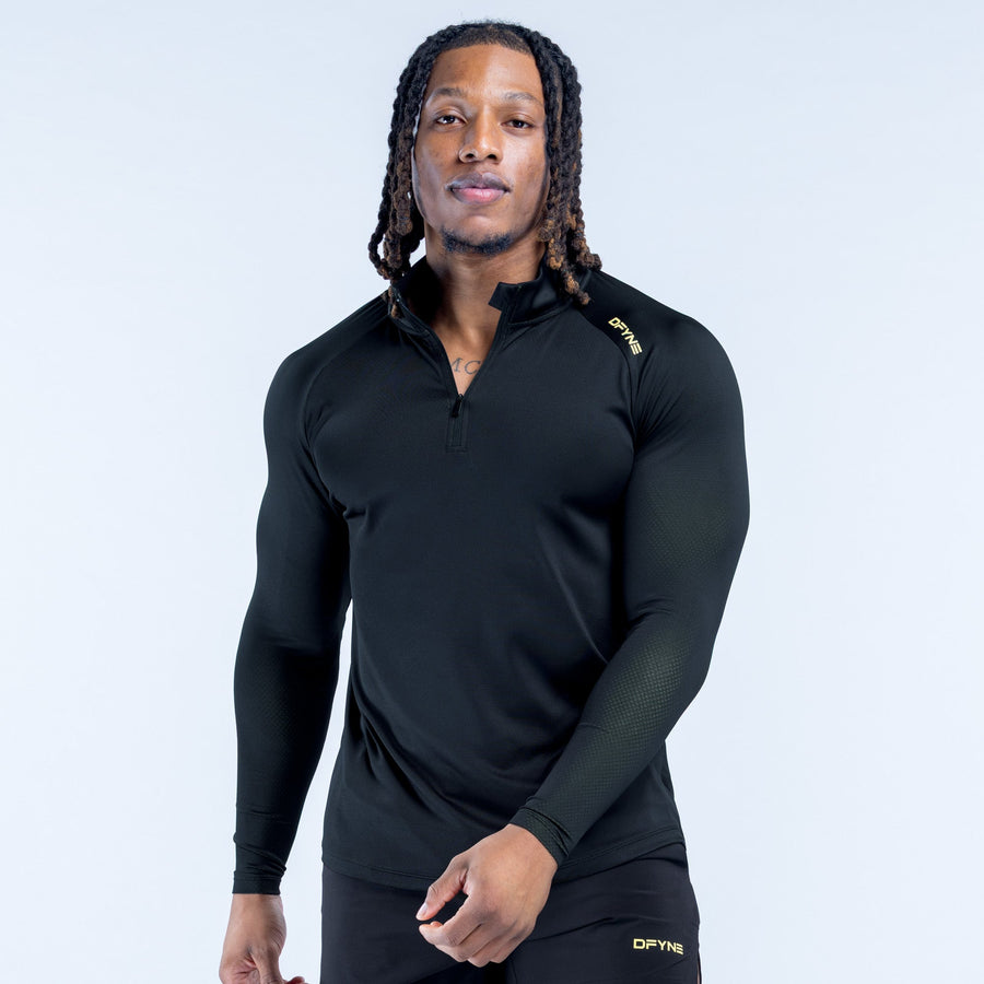 Black quarter-zip athletic top with long sleeves and chest logo