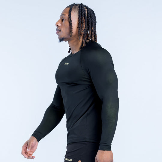 Black long-sleeve training T-shirt side view with crew neck and logo at hem.