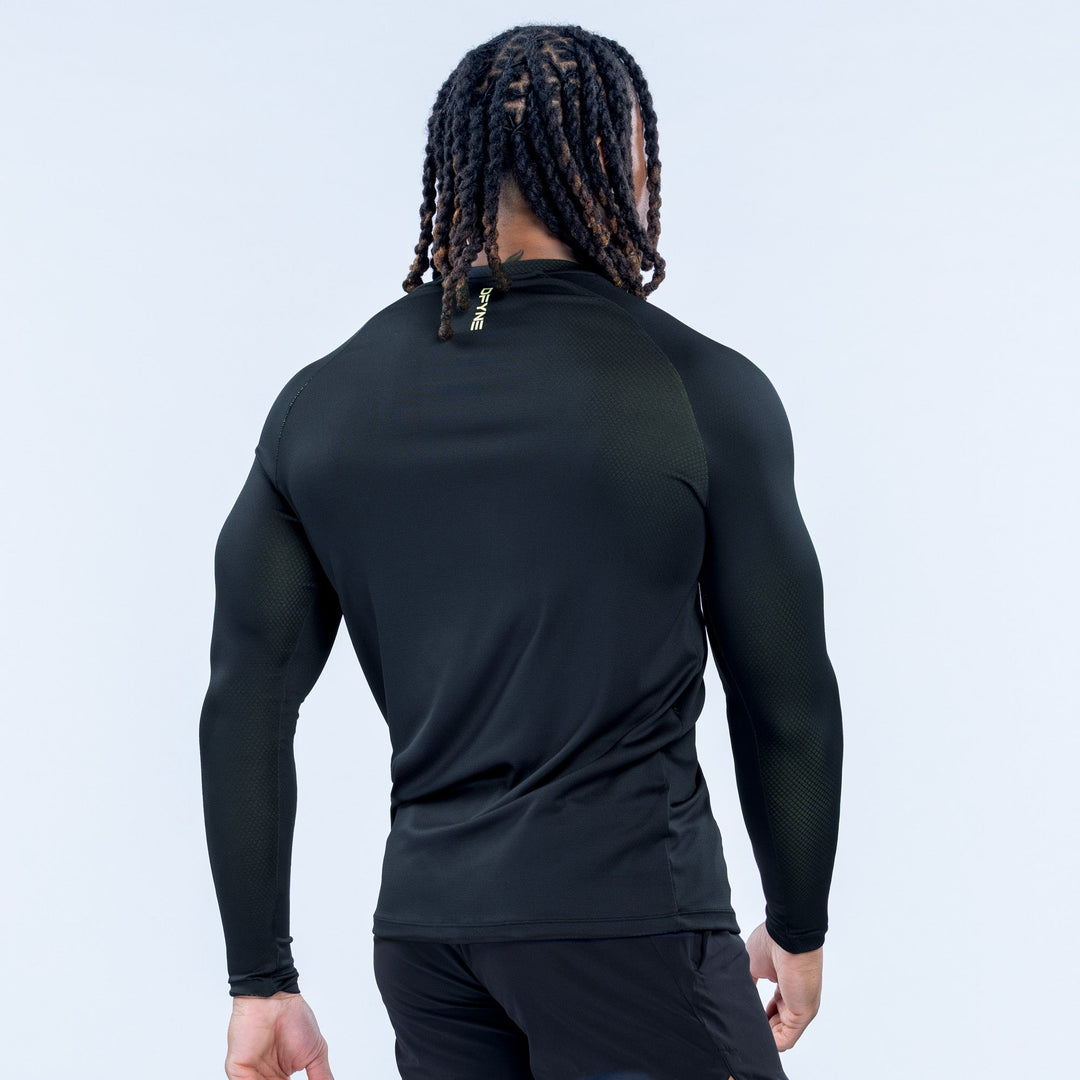 Black long-sleeve training T-shirt from back view, with small back logo.