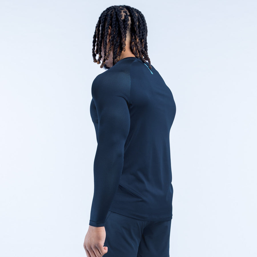 Men's long-sleeve training t-shirt, dark navy, side view with curved hem and logo