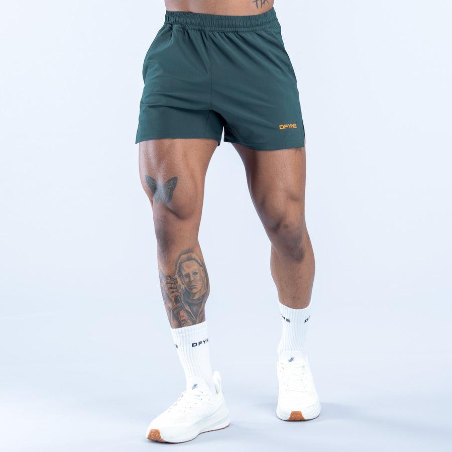 Men's teal training shorts, elastic waist, side pockets