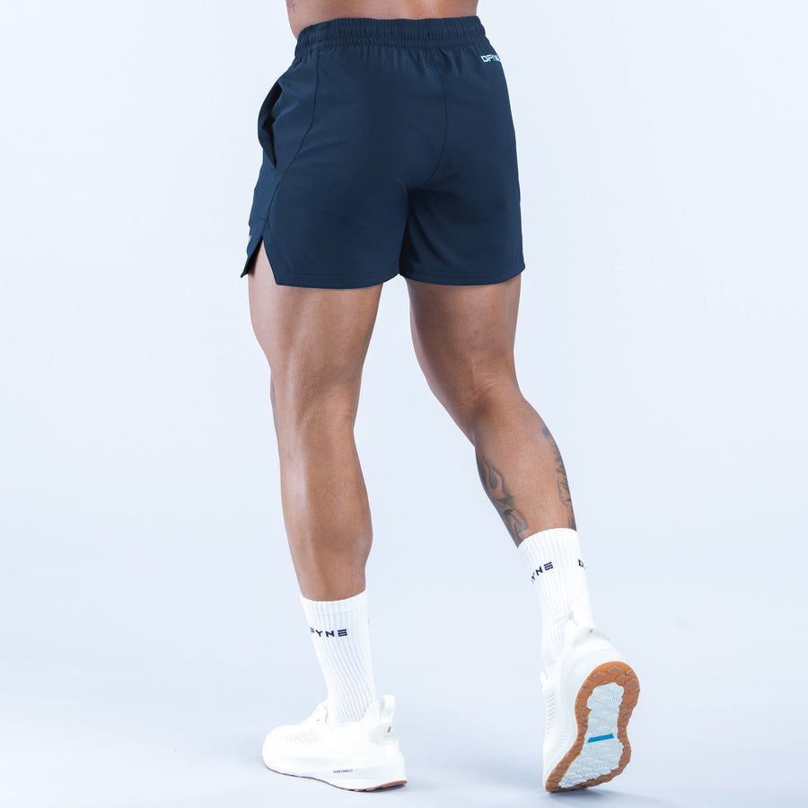 Navy training shorts with side pocket and elastic waistband, angled view