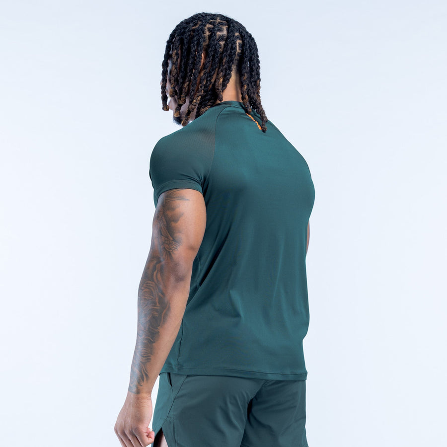 Men's dark green training T-shirt, side/back view with sporty tapered fit