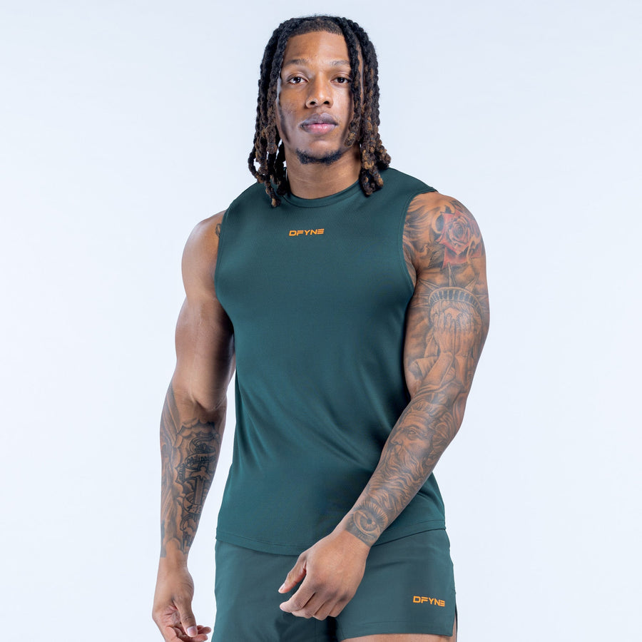 Unbound tank in deep green with crew neckline; small chest logo
